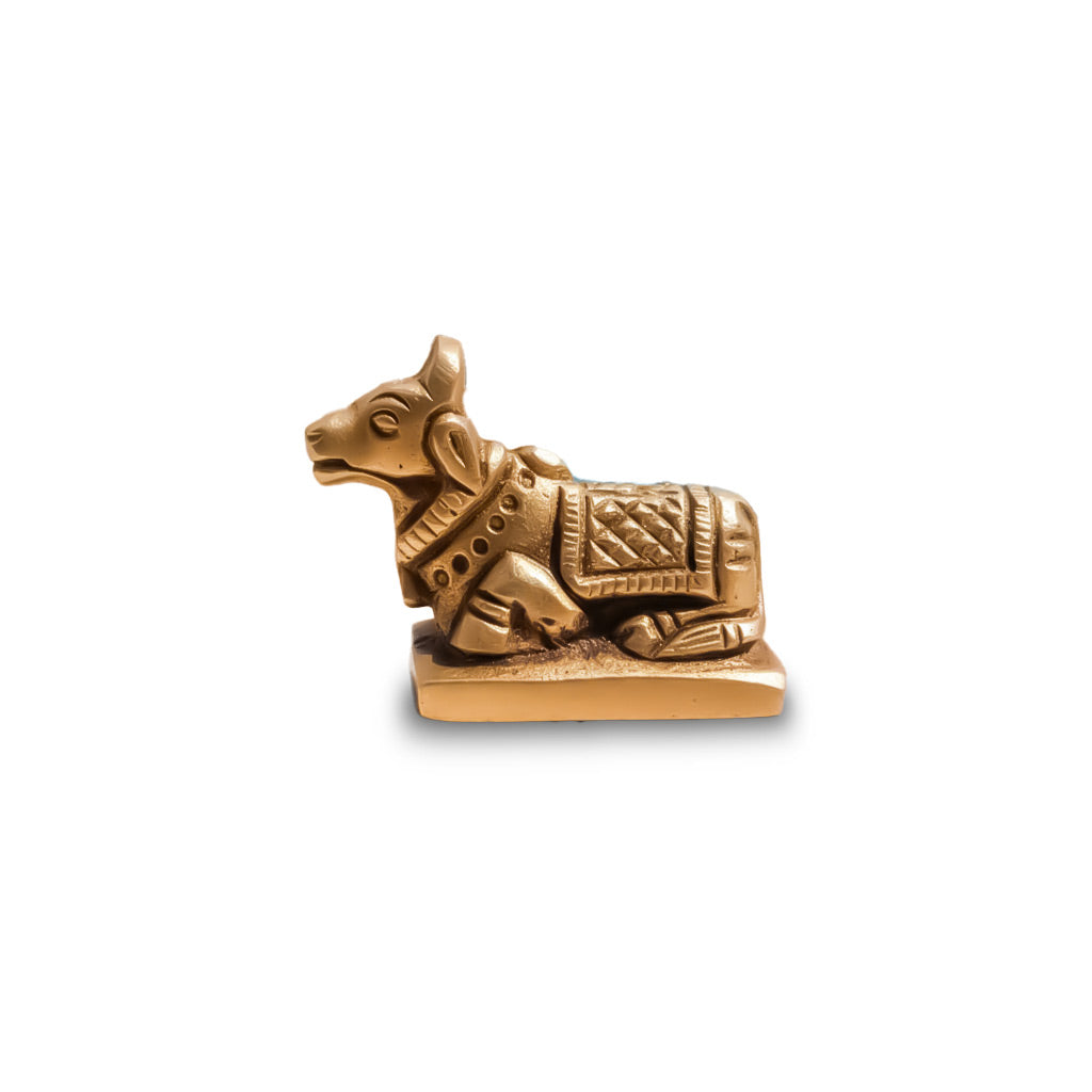 Bronze bull figurine on a white background