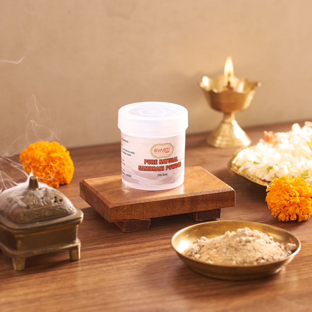 Container of Swasti brand powder on a wooden platform with decorative elements in the background