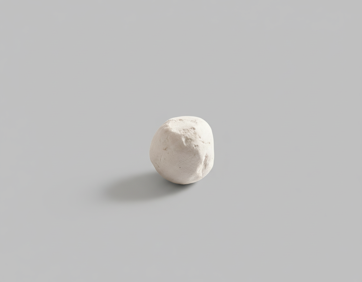 White ceramic sphere on a gray background
