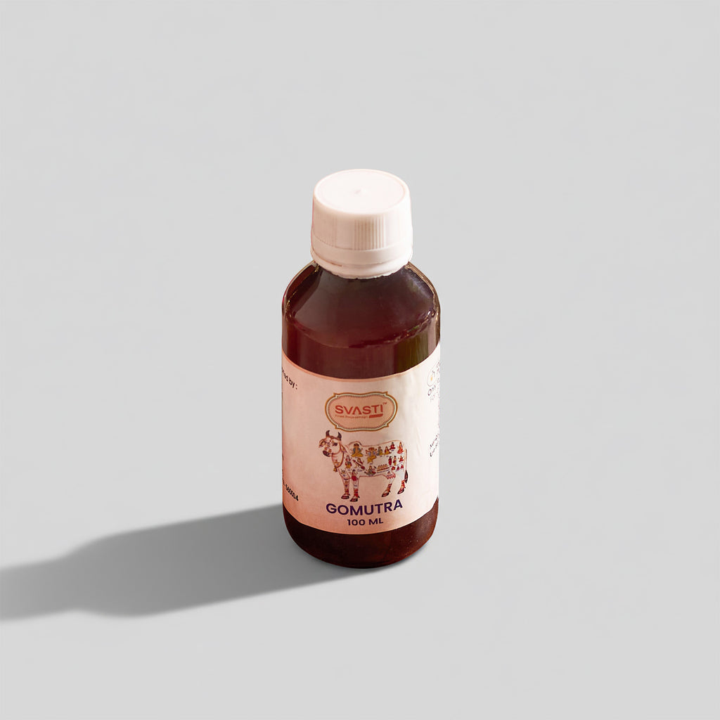 Bottle of Svasti Gomutra on a light gray background