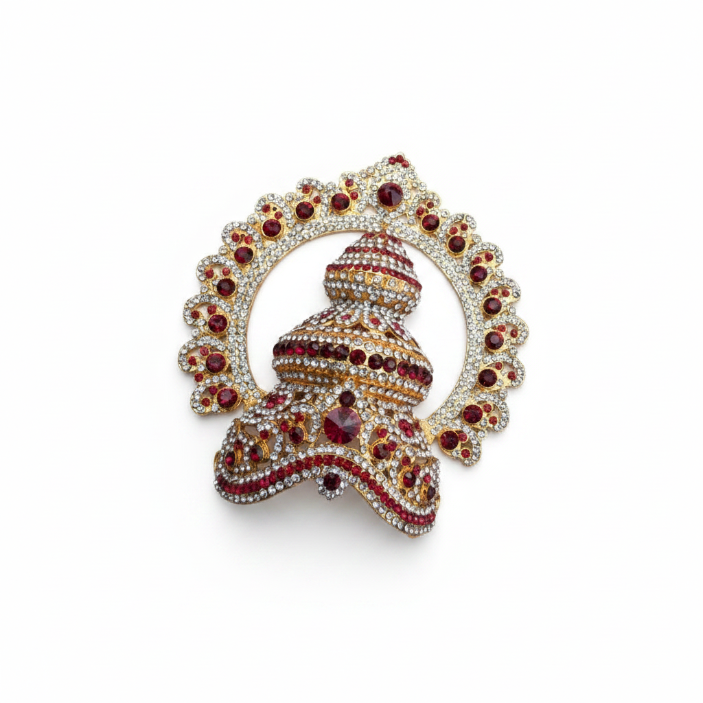 An ornate gold-toned jewelry brooch featuring a tiered dome motif adorned with red gemstones and surrounded by a scalloped halo of clear rhinestones, set against a dark gray gradient background.