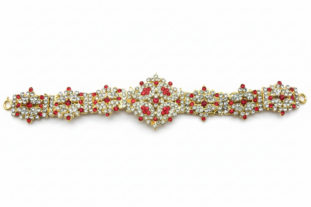 A traditional Indian stone dabu waist belt used in temples, featuring red and white stones with gold-colored metal casing.