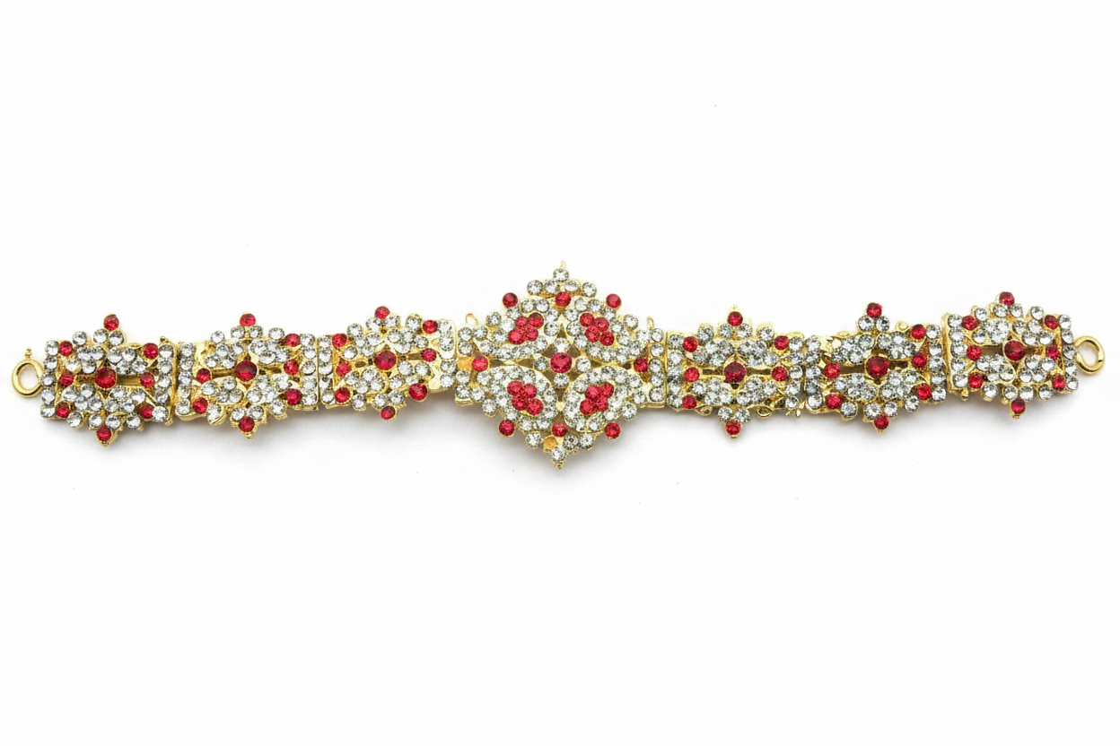 A traditional Indian stone dabu waist belt used in temples, featuring red and white stones with gold-colored metal casing.