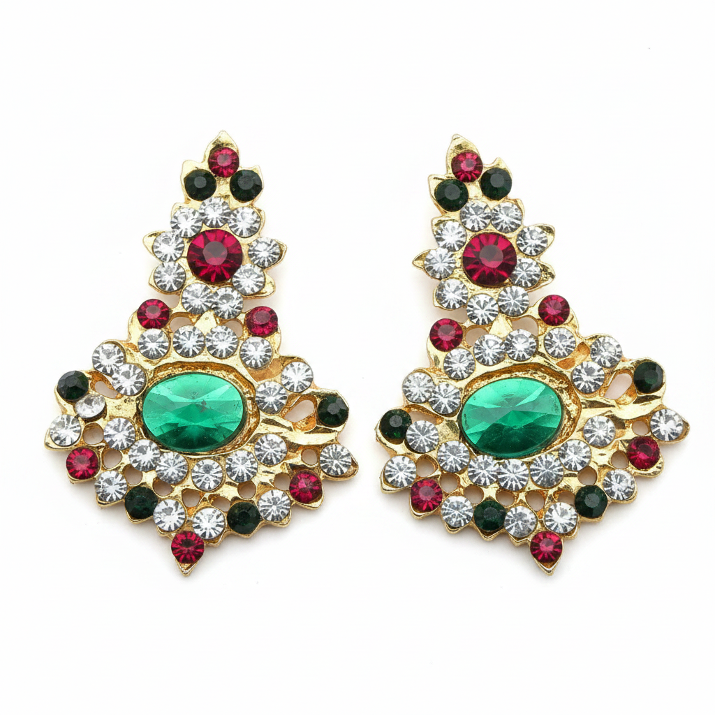 A pair of earrings with red and green stones set in gold-colored metal casing, designed for use in religious ceremonies.