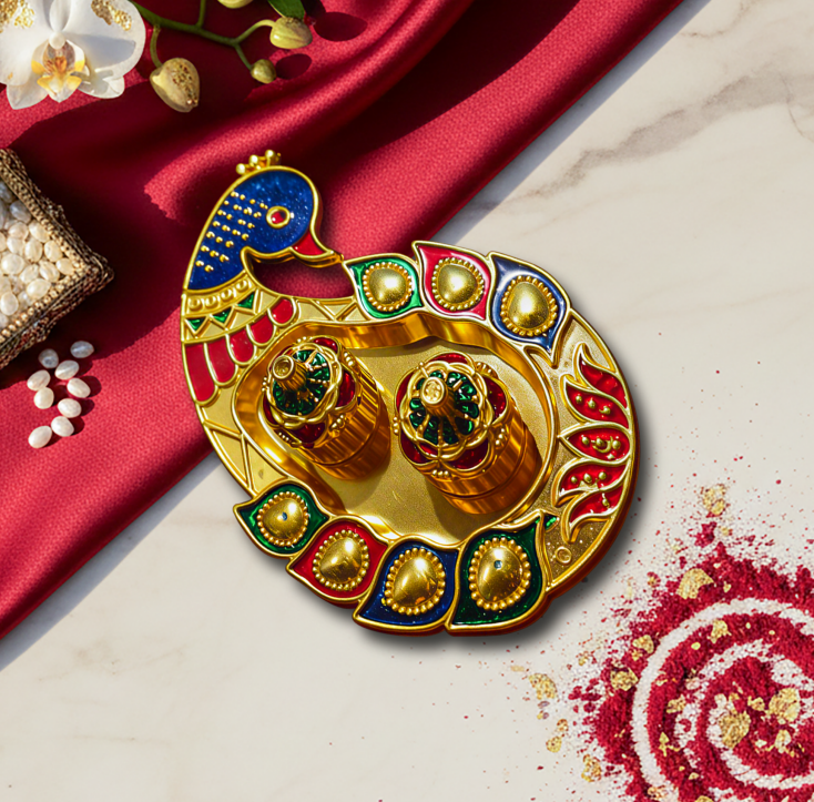 Decorative elephant-shaped tray with colorful design on a red fabric background