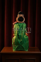 Special Decorated Varalakshmi Idol in Traditional Green and Gold Silk Attire.
