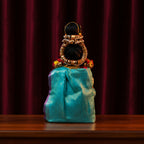 Decorated Lakshmi Idol in Traditional Turquoise Silk Saree