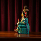 Decorated Lakshmi Idol in Traditional Turquoise Silk Saree