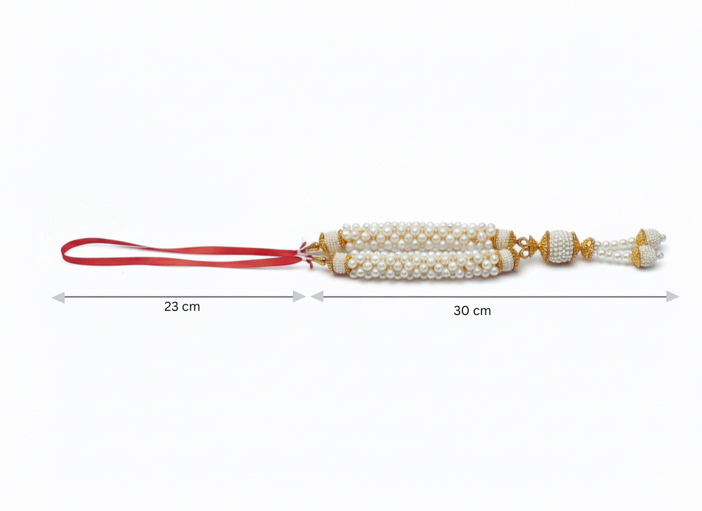 Decorative item with pearls and red ribbon, shown with measurements on a white background