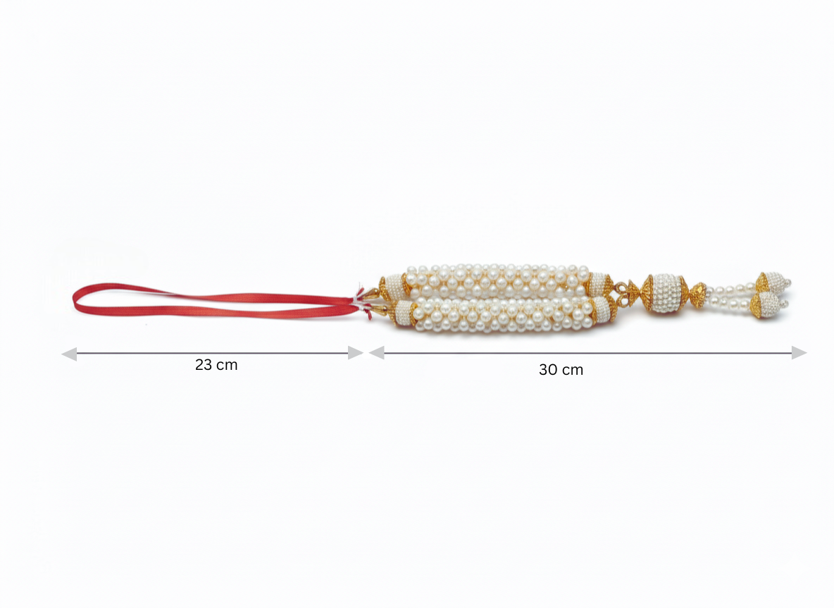 Decorative item with pearls and red ribbon, shown with measurements on a white background