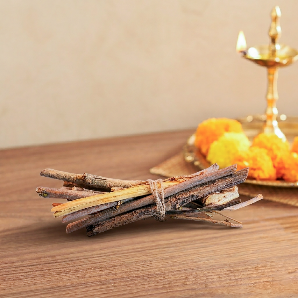 Bamboo skewers tied together on a wooden surface with a blurred background