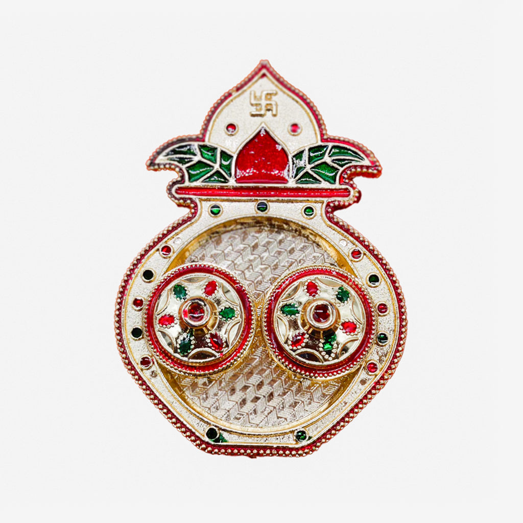 Close-up macro capture focusing on the fine hand-painted red and green enamel details along the mango leaves and the embossed crown swastika.