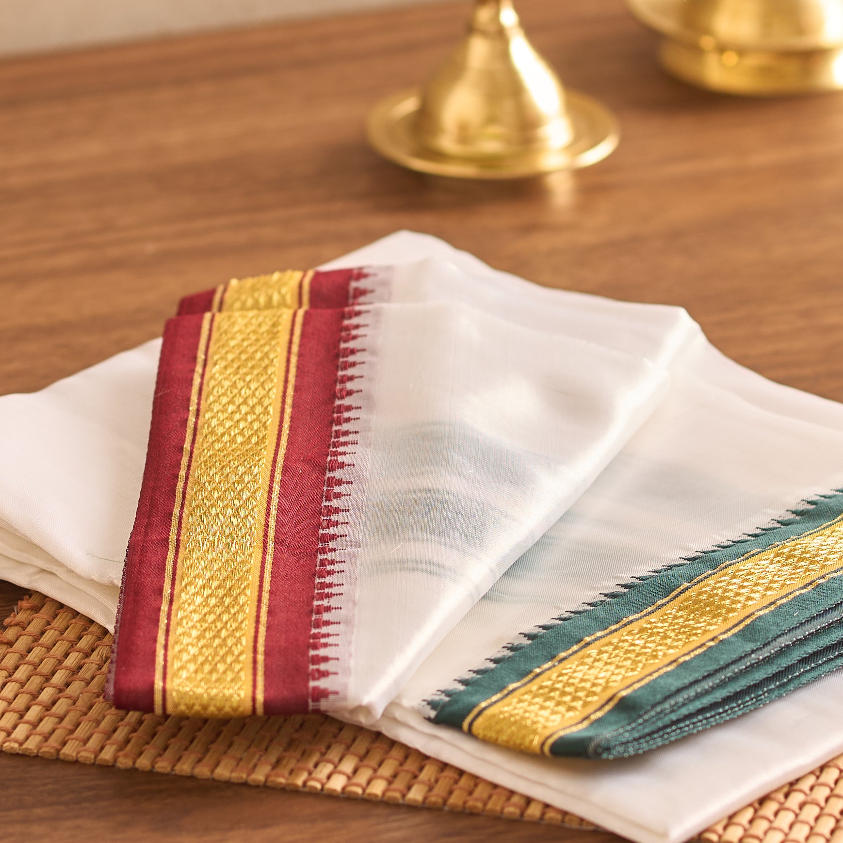 White saree with colorful stripes on a wooden table