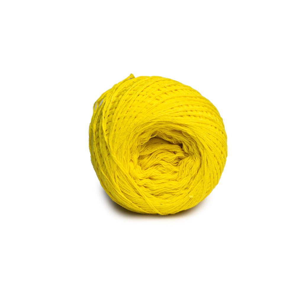 Yellow yarn ball on a white background