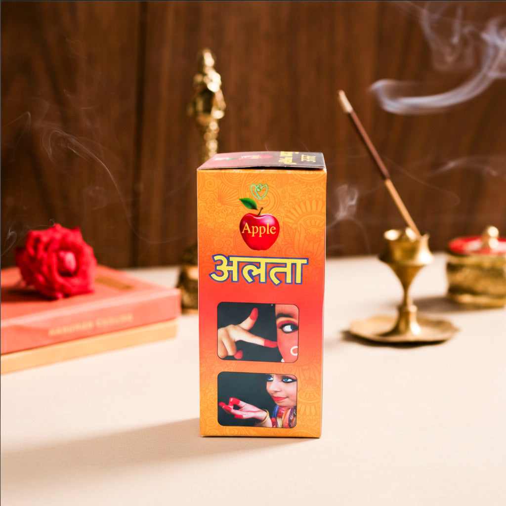 Orange box with 'Apple' branding on a table with incense and flowers