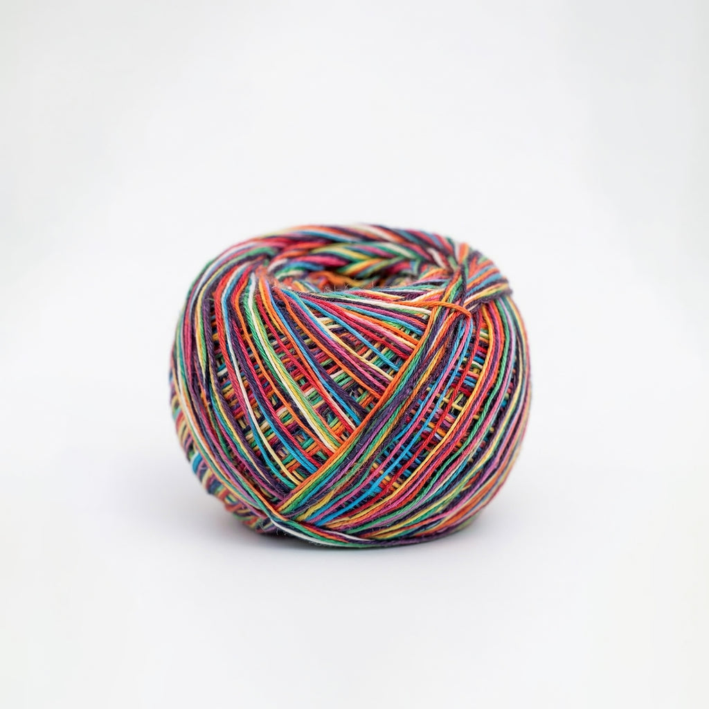 Multicolored skein of yarn on a white background