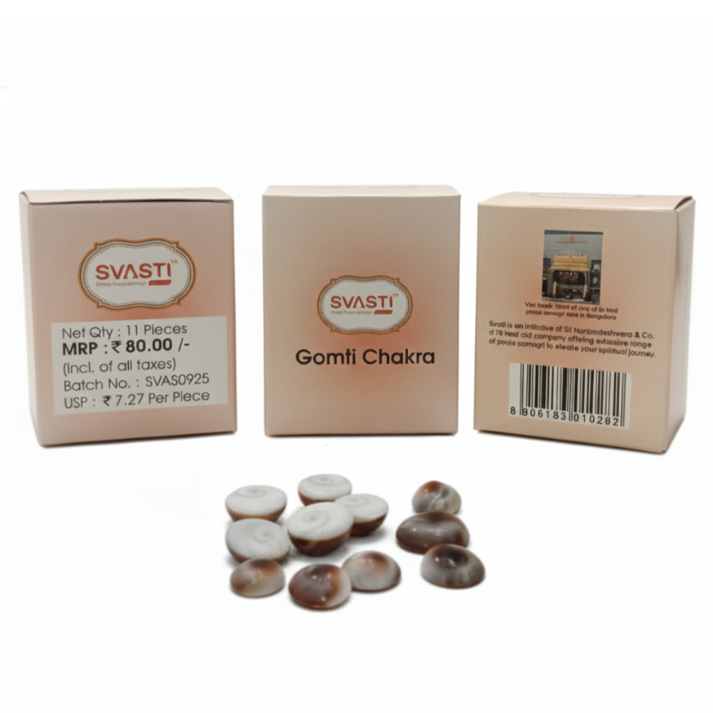 Three boxes of Svasti Gomti Chakra with stones on a white background