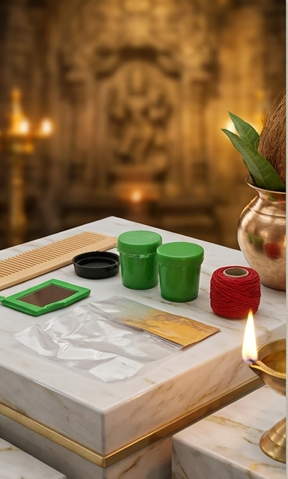 Table setup with green containers, red thread, and other items on a marble surface with a blurred decorative background.