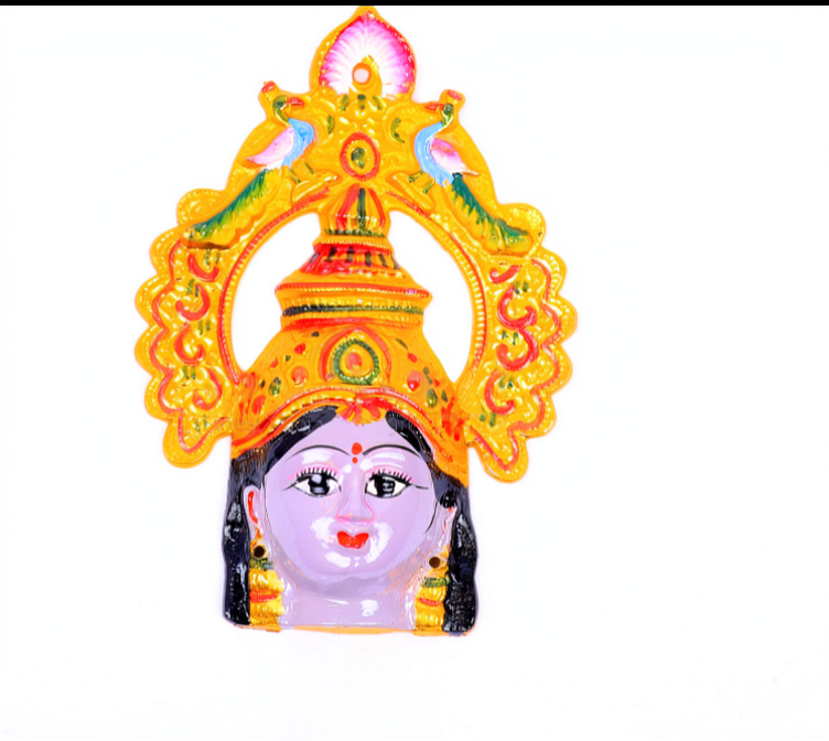 A colorful decorative figurine of a female deity or goddess head with an ornate golden-yellow crown and arch, black hair, and painted facial features on a plain white background.